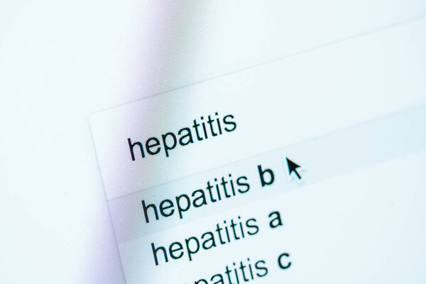 close up view of computer screen with lettering hepatitis a, b, c, world hepatitis day concept