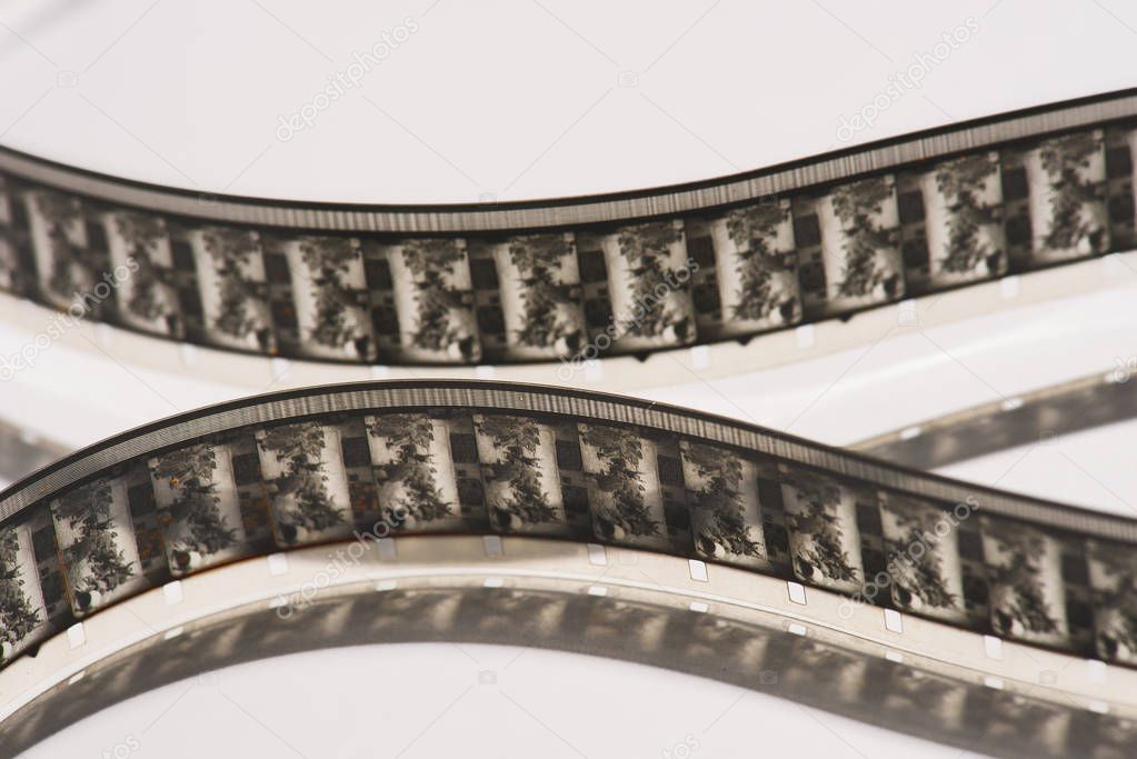 close up view of retro filmstrips on white background