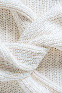 close up view of twisted sleeves of white woolen sweater  clipart