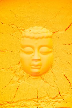 top view of buddha head shape on orange flour texture with cracks clipart