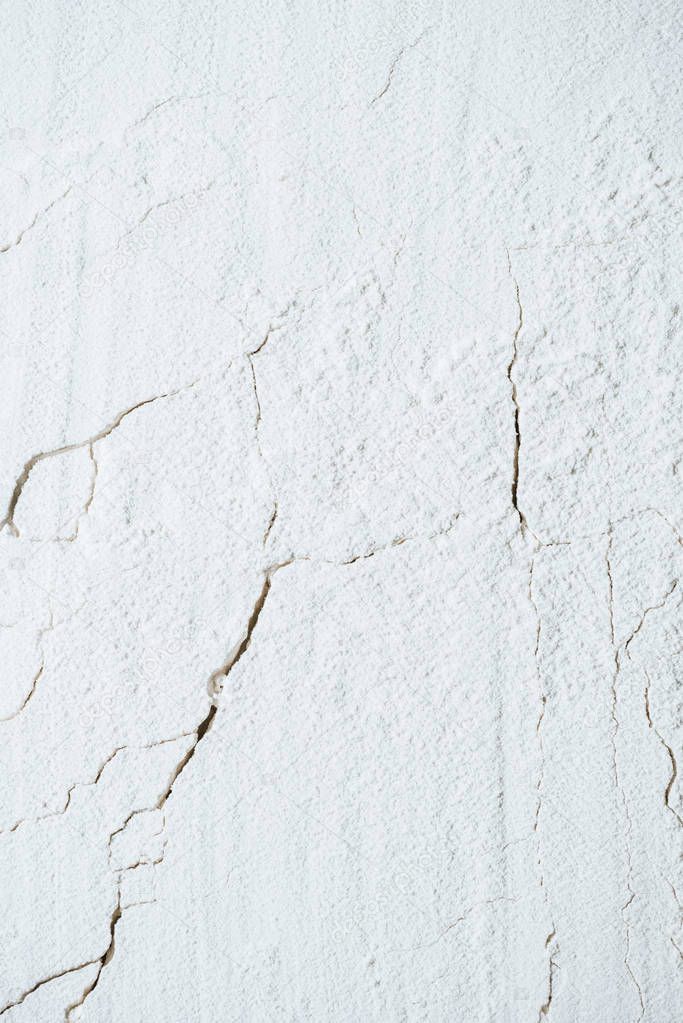 cracked background with white flour texture