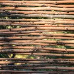 Close-up view of beautiful decorative brown wicker fence background