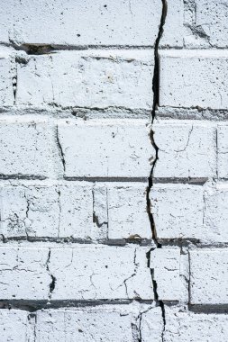 close-up view of old white cracked brick wall background clipart
