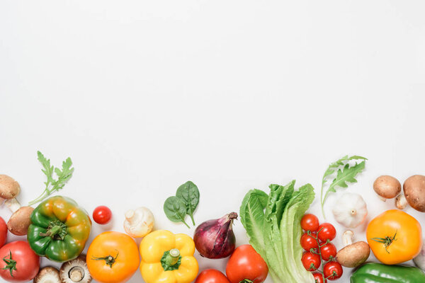 top view of ripe vegetables and herbs isolated on white