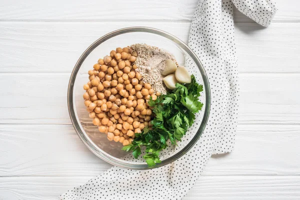 Top View Chickpeas Parsley Spices Ingredients Hummus Bowl Wooden Surface — Stock Photo, Image