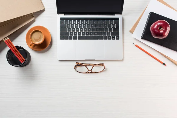 Top View Eyeglasses Apple Coffee Laptop Stationery Table — Stock Photo, Image