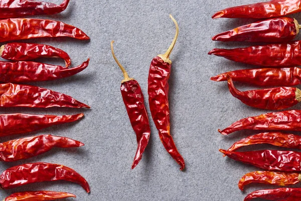 Top View Dried Red Chili Peppers Arranged Grey Tabletop — Stock Photo, Image