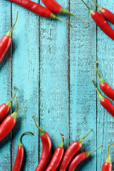 Top View Red Ripe Chili Peppers Blue Wooden Table — Stock Photo, Image