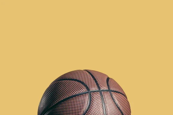 One Rubber Brown Basketball Ball Isolated Yellow — Stock Photo, Image
