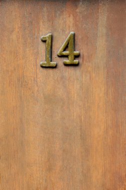 close up view of 14 sign on wooden door clipart