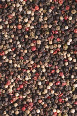 full frame view of dried aromatic peppercorns background clipart