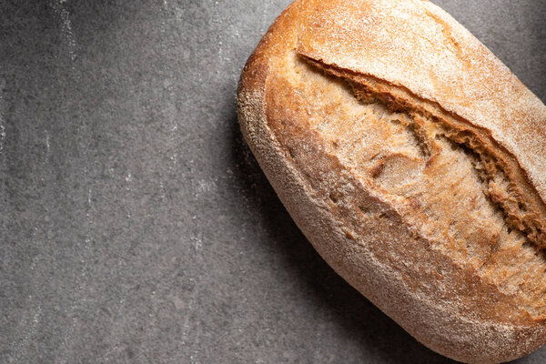top view of ciabatta bread on grey surface
