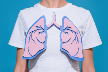 partial view of woman in white tshirt with paper crafted lungs on blue backdrop clipart