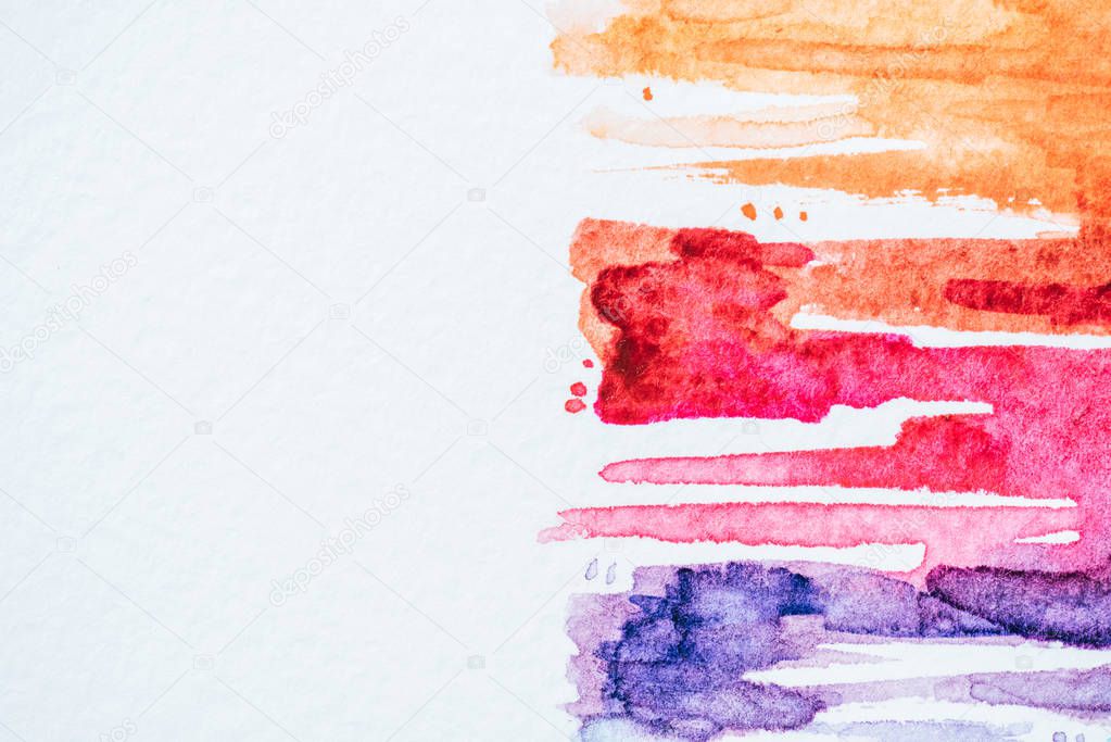 abstract background with colorful watercolor strokes on white paper