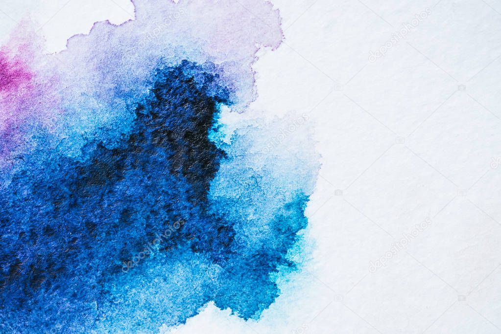 abstract bright blue watercolor painting on white paper