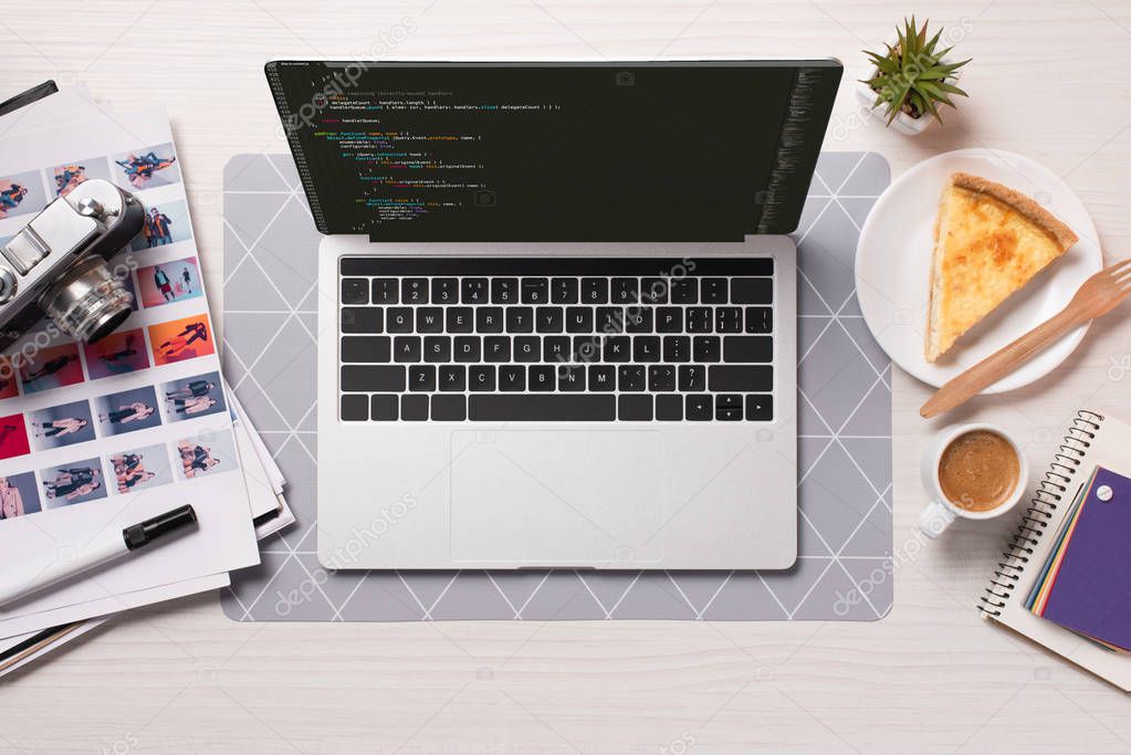 Office desk with laptop with windows software on screen, flat lay