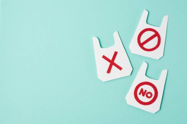 Three paper models of packets with no and prohibition signs on blue background