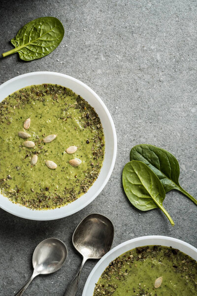 Top view of healthy vegetable creamy soup in bowls