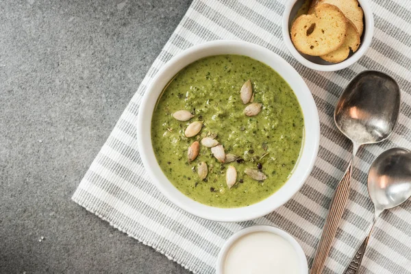 Top view of homemade green creamy soup with croutons and sour cream — Stock Image Top View Homemade Green Creamy Soup Croutons Sour Cream Royalty Free Stock Images