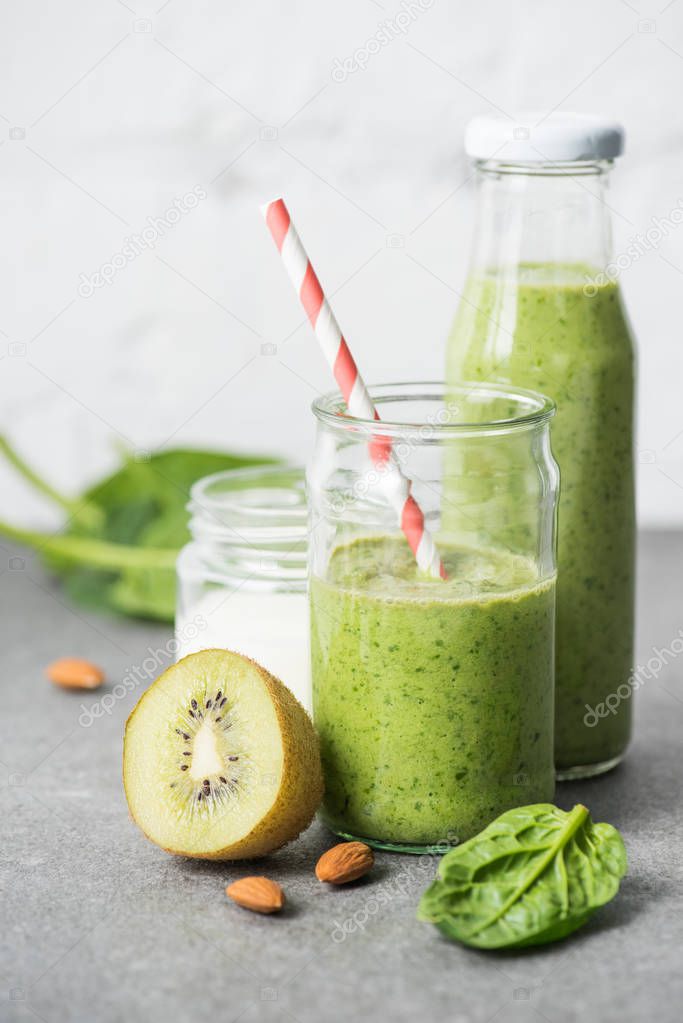Healthy organic smoothie in glasses with ingredients