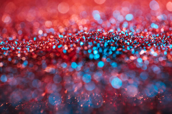 sparking texture with pink and turquoise blurred glitter  