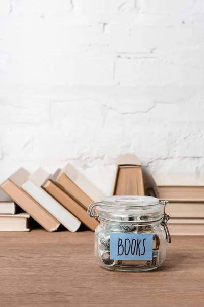 Close View Glass Jar Savings Inscription Books Wooden Table — Stock Photo, Image