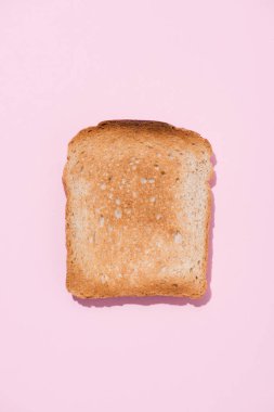top view of crunchy toast on pink surface clipart