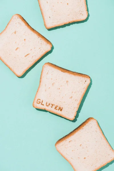 Top View Messy Spilled Bread Slices Burned Gluten Sign Blue — Free Stock Photo