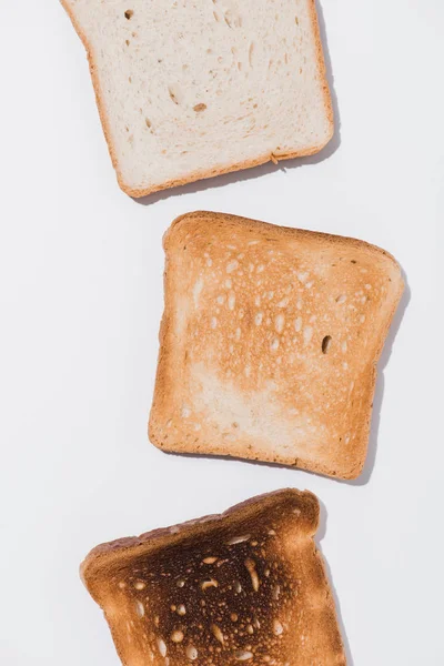 Top View Toasts Various Roast Stages White Surface — Stock Photo, Image