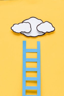 top view of paper ladder with clouds on yellow background, setting goals concept clipart