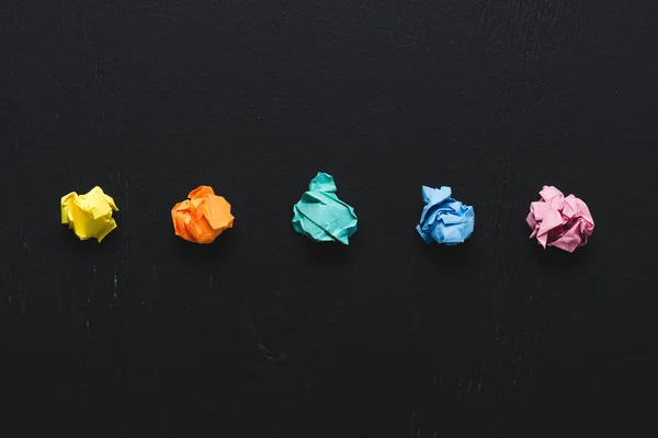 Top View Colorful Crumpled Paper Balls Black Background Think Different — Stock Photo, Image