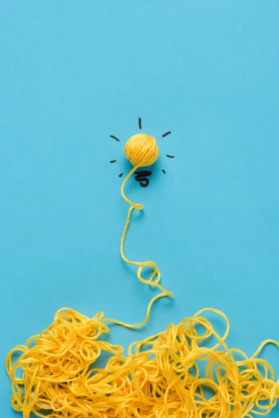 Light Bulb Sign Made Yellow Yarn Blue Background Ideas Concept — Stock Photo, Image