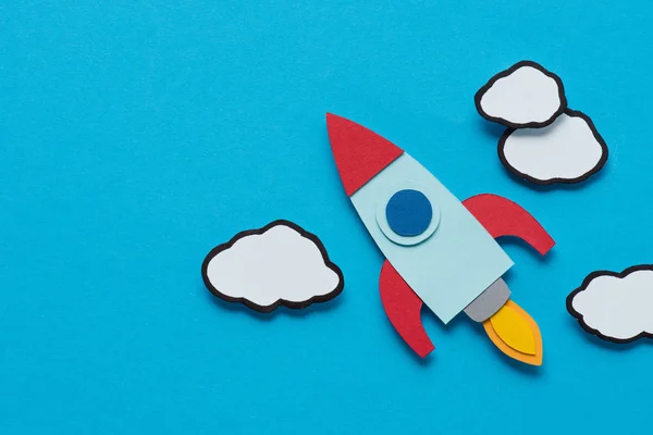 Top View Cardboard Rocket Clouds Blue Background Setting Goals Concept — Stock Photo, Image