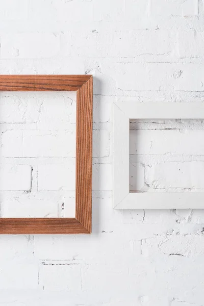 Brown White Empty Frames Hanging Brick Wall — Stock Photo, Image