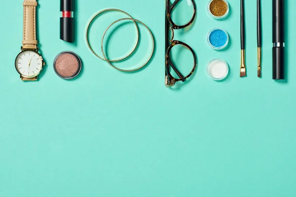 Top View Watch Lipstick Bracelets Glasses Eyeshadow Blush Cosmetic Brushes — Stock Photo, Image