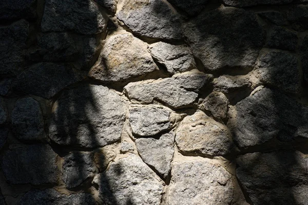 Imagen de marco completo de pared de piedra con fondo de luz solar - foto de stock