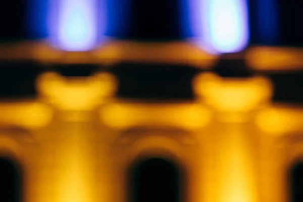 Close up view of blurred city building at night — Stock Photo