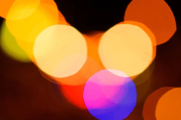 Vista de perto de luzes bokeh coloridas como fundo — Fotografia de Stock