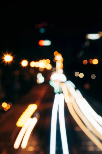 Night city lights in bokeh style background — Stock Photo