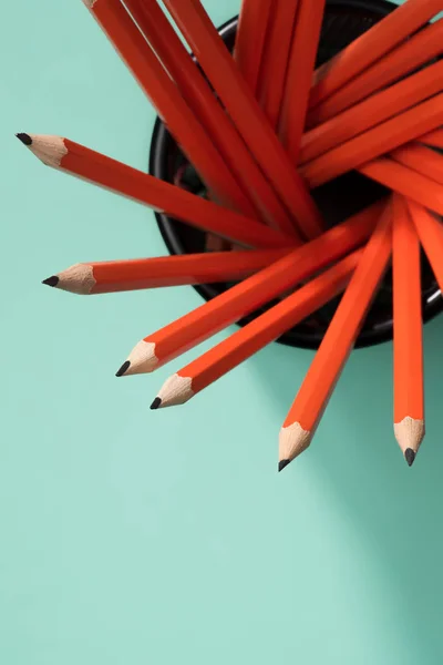 Top view of graphite pencils in desk organizer on green — Stock Photo