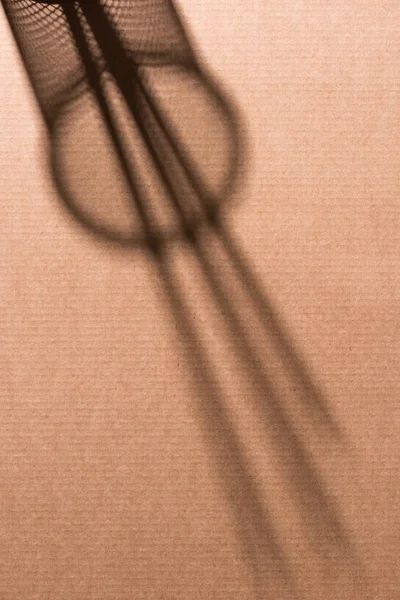 Top view of shadow of desk organizer with pencils on cardboard — Stock Photo