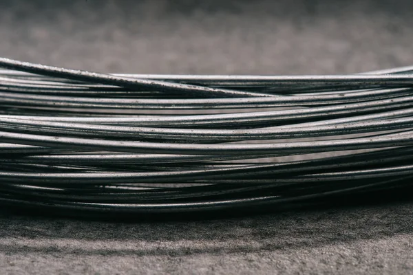 Selective focus of grey wires on tabletop — Stock Photo