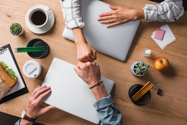 Cropped shot of businesspeople doing fists gesture at workplace — Stock Photo