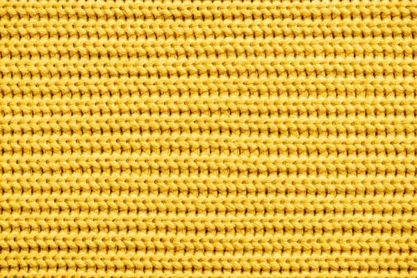 Full frame image of yellow knitted woolen fabric background — Stock Photo