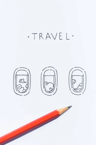 Close up view of pencil on white paper with travel lettering and plane windows illustration — Stock Photo