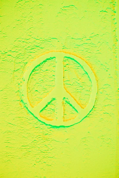 Top view of peace sign in light green powder — Stock Photo