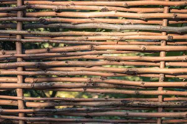 Close-up view of beautiful decorative brown wicker fence background — Stock Photo