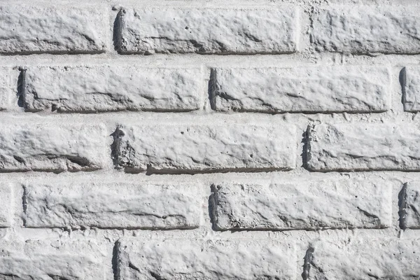 Close-up view of white aged brick wall background — Stock Photo
