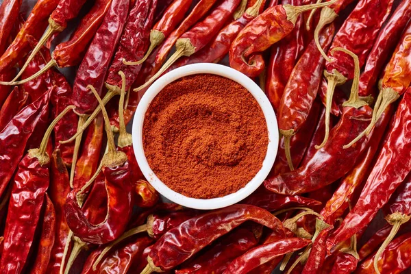 Top view of arranged grinded and wholesome chili peppers — Stock Photo