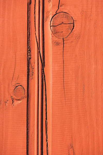 Close up of orange wooden fence with cracks — Stock Photo